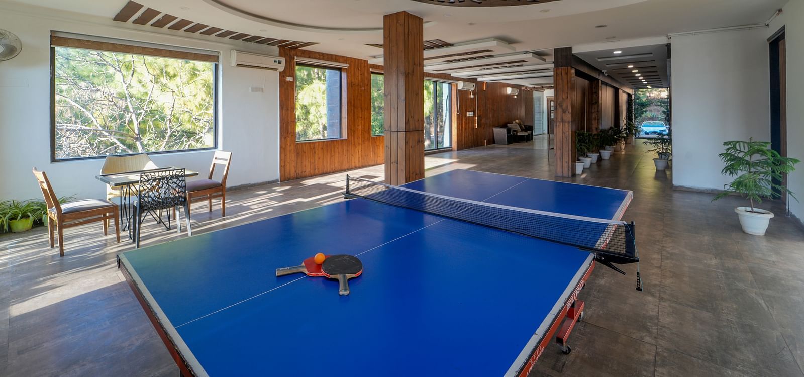 The game area of DLS Whispering Winds featuring a table tennis table